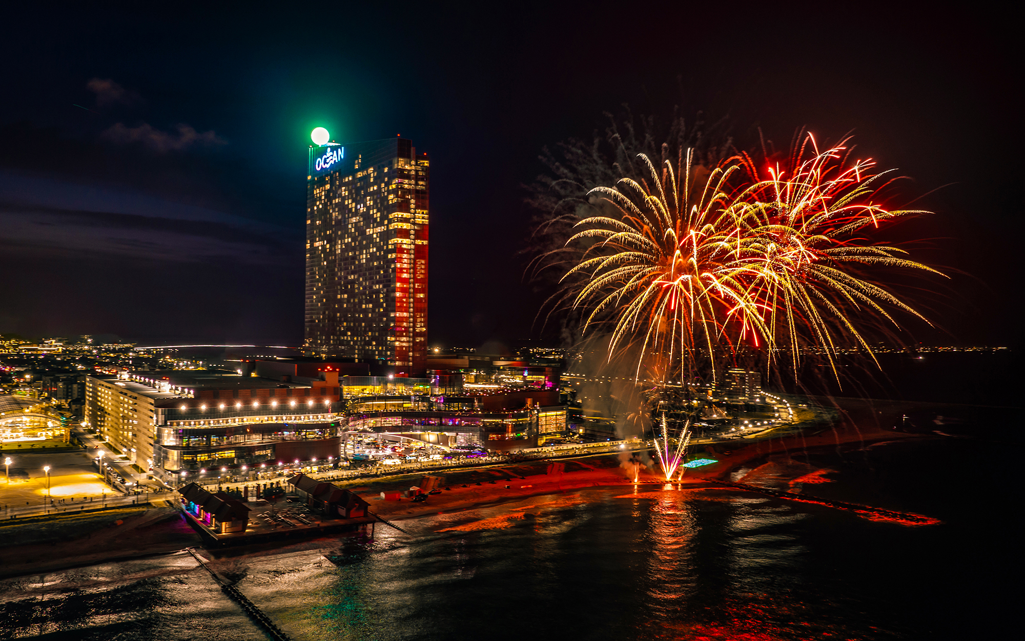 Fireworks light up the sky over Ocean Casino Resort during a nighttime celebration of its 7th birthday.