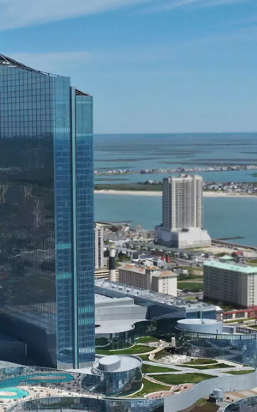 Aerial view of Ocean Casino Resort with Atlantic City and water in the background