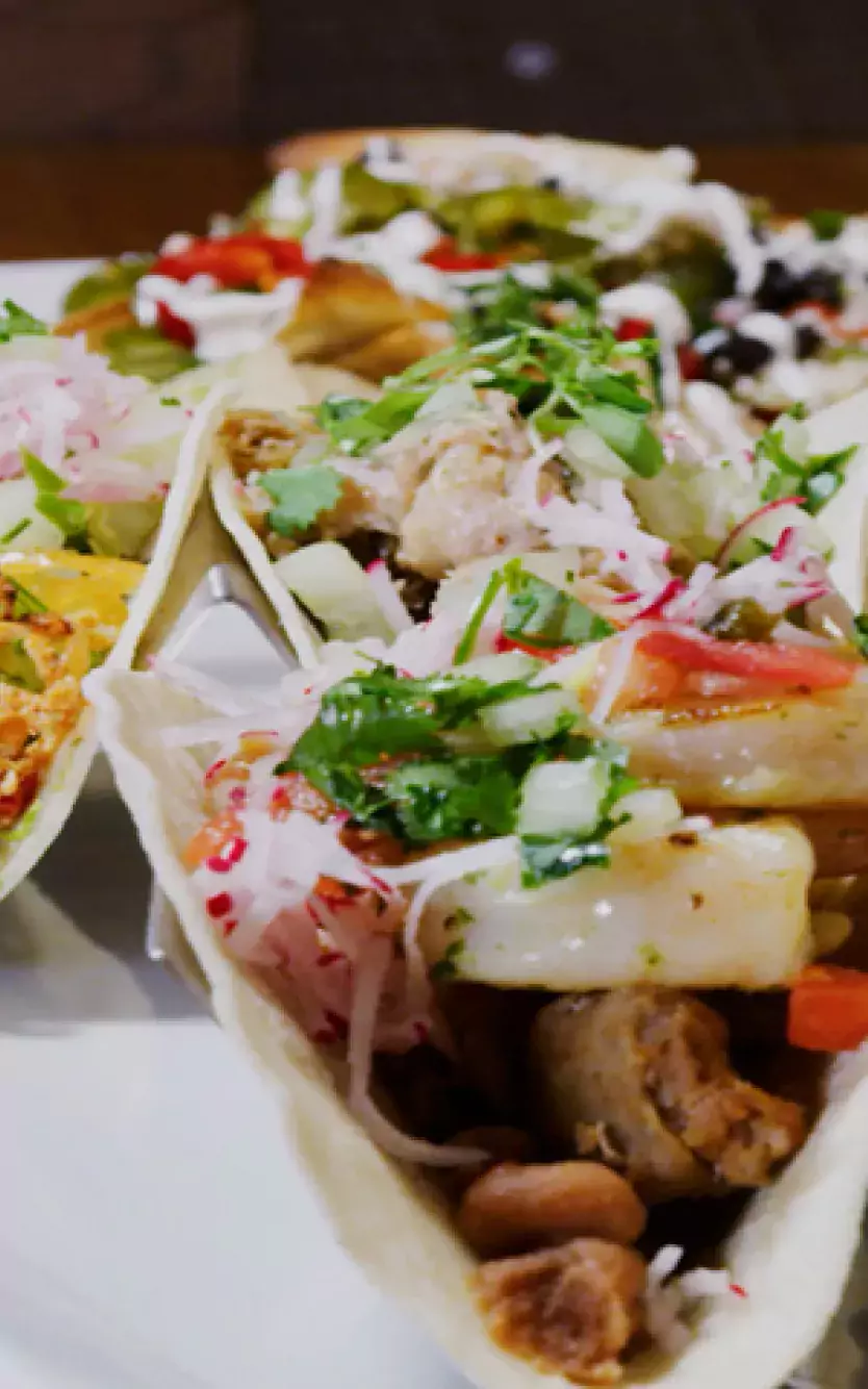 Various plated tacos at Distrito restaurant