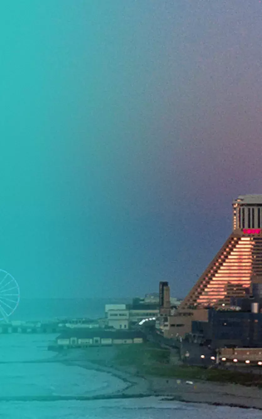 Exterior of Ocean Casino Resort next to the best of gaming awards for 2020 logo 