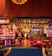 Festive Jingle Bell Bar at Ocean Casino Resort featuring holiday lights, décor, and themed cocktails.
