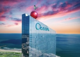 Ocean Casino Resort with giant cherry on rooftop at sunset, celebrating its 7th birthday in Atlantic City.
